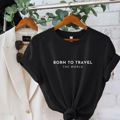 Born To Travel The World Soft Cotton T-shirt. Made With Love & Purpose. This T-shirt is a Love at first sight. There's nothing better than a shirt that makes you feel comfortable and stylish at the same time. Style this modern T-shirt with a skirt, jeans or leggings, add a piece of jewelry, put on your favorite shoes and you're ready to go make memories. This tee makes a perfect gift for all Travel Lovers.  GENERAL INFORMATION - Bella And Canvas Brand Shirts - Unisex Adult Sizing - Rolled Sleeve Capsule Clothing, World Tshirt, Clothing Minimalist, Vacation Clothing, Travel Tshirt, Minimalist Shirt, Skirt Jeans, Minimalist Shirts, Travel Capsule