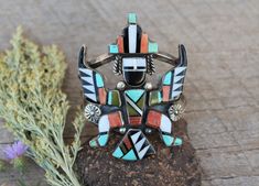 "Wonderful Zuni Knifewing bracelet by Arnold Cellicion. Attr. Great stones and shell combine with straightforward silver-work on this very nice example of Zuni inlay art. Measures: 5.5 ' interior end to end plus and additional 1.25\" gap. Adjustable. .25\" h at the face. Weighs: 72 grams. Condition is very good with minor sealed cracks to the jet at the wingtip." Natural Blue Diamond, Zuni Jewelry, Native Jewelry, Silver Work, Taos, Native American Jewelry, Blue Diamond, Stone Bracelet, Native American