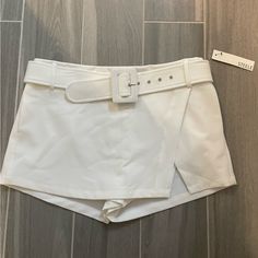 Steele White Ramona Skort. Size Medium, Nwt! White Fitted Belted Bottoms, Fitted Bottoms With Belt For Day Out, Fitted Short Belted Bottoms, Fitted Belted Short Bottoms, Fitted Summer Bottoms With Belt, Belted Shorts For Summer Night Out, Belted Shorts For Night Out In Summer, Fitted High Waist Shorts With Belt, White Belted Bottoms For Summer