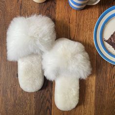 Delight yourself or someone else with these gorgeous alpaca fur slippers that feel like fluffy little clouds on your feet. These slippers are perfect for traveling, as they're lightweight, pack flat and come with a Fluff Alpaca muslin bag. Despite their light weight, they envelope your feet in a deep cushion of alpaca fur, merino lambskin and suede for added natural softness and durability. Ideal for both transitional weather and through the winter months. Designed in Scotland by Samantha Holmes White Fluffy Slippers With Round Toe, Comfortable Fluffy White Slippers, Fluffy White Slip-on Slippers, White Fluffy Indoor Slippers, Fluffy White Indoor Slippers, Cozy White Closed Toe Slippers, Alpaca Clothing, Alpaca Gifts, Pet Brush