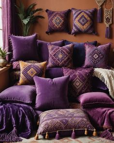 a purple couch with many pillows on it