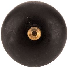 an old black door knob with a gold colored eyeball on the front and side