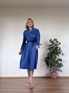 "Gorgeous a-line romantic belted vintage midi dress in blue. The dress is very comfortable, there is a lining under, it shapes the body nicely.  Condition: excellent vintage condition. If you are looking for a comfort - this dress is for you! Model usually wears size M and is 168 height. Measurements (measured while lying flat on the floor): Shoulder to shoulder: 38 cm | 14.9\" Bust: 47 cm | 18.5\" Waist: 41 cm | 16.1\" Length: 113 cm | 44.4\" Label: Diolen Every piece in this shop is hand selected from different places.   All those garments are bought second hand, that is why they are always unique and sometimes might have imperfections.  Choose circular fashion over fast fashion and create your own style. I hope you love your new piece and...don't forget, there is a little bit of magic i Retro Blue A-line Midi Dress, Blue Belted A-line Midi Dress, Vintage Blue A-line Midi Dress, Blue Vintage A-line Midi Dress, Vintage Blue A-line Dress, Blue Midi Vintage Dress For Party, Blue Knee-length Vintage Dress For Party, Blue A-line Vintage Fashion Dress, Retro Blue Tea Length Dress