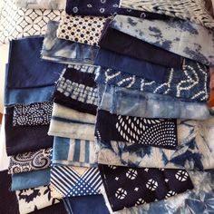 a pile of blue and white cloths sitting on top of each other