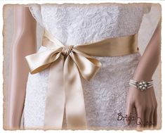 "Wedding Sash Belt, 2\" French Deluxe Champagne Bridal Sash, Champagne Wedding Sash, Champagne Satin Ribbon Bridal Belt, Wedding Sash, Satin Bridal Sash WIDTH: 2\" (5 cm) LENGTH: please select from the drop down menu. This Luxurious Bridal Sash is made from superior quality double faced satin ribbon imported from FRANCE. THIS IS NOT THE KIND OF RIBBON THAT YOU FIND AT CRAFT STORES ! This is bridal boutique quality ribbon. This ribbon is thicker and softer, it is lustrous, has silky touch and dra Elegant Bridal Belt With Satin Bow For Wedding, Elegant Ribbon Bridal Belt For Wedding, Wedding Bridal Belt With Sashes In Satin, Satin Bridal Belt With Ribbon For Wedding, Fitted Gold Sash For Wedding, Cream Bridal Belt With Sashes For Wedding, Fitted Bridal Belt With Ribbon For Wedding, Satin Wedding Sash, Fitted Ribbon Sash For Wedding