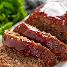 meatloaf on a plate with lettuce and sauce