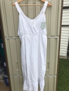 Prima Donna White Cotton  Slip Dress   NWT Made in Canada 100% Cotton Size medium Ruffled bottom Eyelet Slip has been dry cleaned Measurements taken while laying flat Pit to pit 18" Waist 15" Straps 6" Length from top of straps to bottom 48" Purchase price includes free shipping in Canada and the USA International shipping is available Please contact before purchase for shipping quote Any questions, just ask!  Vintage item, regular wear due to age should be expected  Any known flaws/ markings wi Cotton Slip Dress, Cotton Slip, Dream Clothes, White Cotton, Slip Dress, Bathing Beauties, Slip On, Lingerie, Music Clothes