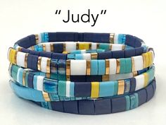 "\"Judy\" - A mix of navy, turquoise, and ocean blue, white, yellow, and gold plated Tila beads. Combination of 5x5, 1/2, and 1/4 size beads. Perfect gifts for women and teens. Each bracelet is $13, save $3 and get FREE SHIPPING on orders of three bracelets!" Tila Jewelry, Trendy Beaded Bracelets, Tila Bead Bracelets, Stretch Beaded Bracelets Diy, Tila Bracelets, Boho Bracelets Stack, Bracelet Trendy, Stack Bracelets, Bracelets Boho