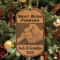 a wooden ornament hanging on a christmas tree with the words best buds forever