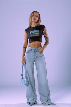 DESCRIPTIONThe hottest trend in denim for this season! The oversized jean features a cross waistband and baggy pant is now available in a vintage-inspired wash. Model is wearing size 25 DETAILSFront Rise: 11 3/4”Leg Opening: 21”Inseam: 33 1/2“100% Cotton Denim High Waist Medium Wash Flare Jeans For Streetwear, High Rise Medium Wash Flare Jeans For Streetwear, Edgy High Rise Flare Jeans In Medium Wash, Edgy High Rise Medium Wash Flare Jeans, High Waist Cropped Jeans In Medium Wash For Streetwear, High Rise Flare Jeans In Washed Blue For Streetwear, Urban High Waist Medium Wash Flare Jeans, Urban Style High Waist Medium Wash Flare Jeans, Casual Cropped Jeans For Streetwear