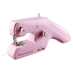 a pink sewing machine sitting on top of a table