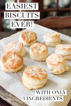 some biscuits are sitting on a piece of parchment paper with the words easy biscuits ever