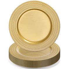 a stack of gold plates sitting on top of each other