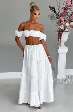 Cut from crisp cotton blend fabric, the Carmen set is made for brunching on balmy days. This top has a cropped fit with a delicate halterneck ties to the centre and pretty puff sleeves that sit off the shoulder. With all-over ruched detailing, the look is complete with a flirty corsage flower to the centre. Pair her with the Carmen maxi skirt for the prettiest fit you'll wear this season.    Colour: White.  Non stretch cotton blend fabric.  Ruched detail.  Puff sleeves that sit off the shoulder. Homecoming Dresses Corset, White Dress Spring, Dressy Clothes, Long Sleeve Homecoming Dresses, Bahamas Cruise, Homecoming Dresses Long, Bright Winter, Maxi Dress Sale, Popular Dresses