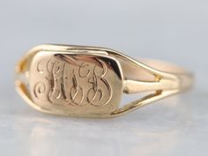 The engraving of this gold signet ring bears the monogram "FTB" wrought in scrolling French script that's a lovely match to the pretty curves of the mounting. This sophisticated, vintage signet ring is sure to be a treasured memento. Please note that this signet ring has its original monogram, unfortunately, this piece cannot be altered without affecting the quality of the piece, please feel free to contact us to help you find your perfect signet ring in your style and budget! Metal: 10K Yellow Signet Rings Women Vintage, Baby Gold Rings, Ring Initial, Signet Rings Women, Ring Bear, French Script, Signet Ring Men, Tiny Rings, Monogram Ring