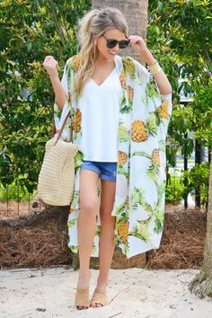 What's the next best thing to a pina colada on the beach? This kimono!! The whimsical pineapple print has us dreaming of our next tropical getaway. The breezy, lightweight fabric makes it the perfect warm weather topper. Tropical Getaways, Pineapple Print, Blue Door, Pina Colada, Vacation Outfits, Kimonos, Lightweight Fabric, Boutique Clothing, Warm Weather