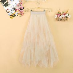 This is perfect for those who are looking for a clothing for a good price. It is fashionable, stylish, and it will look great on anyone who wears it. Do you wanahavit? Spring Party Tulle Skirt, Spring Party Maxi Tulle Skirt, Spring Party Maxi Skirt With Tulle, Spring Party Tulle Maxi Skirt, Tulle Maxi Skirt For Party, Summer Tulle Maxi Flared Skirt, Summer Flared Tulle Maxi Skirt, Beige Ruffled Skirt For Parties, Beige Party Skirt For Spring