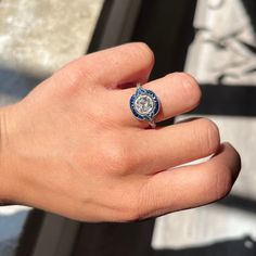 Is exquisite the word you are looking for? Yep, that is the exaxct same word which also came to mind when we were offered this ring! We just ADORE everything about it - the chunky, bright and super sprakly old mine cut center, the bright and vivid blue natural custom cut sapphires surrounding the diamond, and of course Modern Mens Rings, Sapphire Halo Ring, Art Jewelry Earrings, Old Mine Cut Diamond, Jewel Necklace, Antique Watches, Antique Engagement, Mens Band, Vintage Band