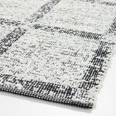 a black and white rug with squares on it