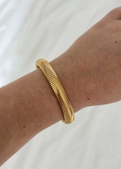 A stretchy gold plate bracelet. Gold Plated Bracelets, Bangle Bracelets, Gold Plate, Bangles, Bracelet, Gold