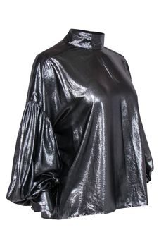 Get sparkling and stunning in this shining silver blouse from Closed. Made with a mock neckline, this balloon sleeved beauty is a metallic marvel, perfect for pairing with flared pants for a disco look, or go totally cool with some leather leggings. Size M 100% Polyester Mock neckline Long puffed sleeves Back button closures Waist 43" Total length 24" Chic Metallic Shine Tops, Chic Metallic Tops With Shine Detail, Glamorous Sheen Tops For Spring, Chic Shimmer Top For Fall, Chic Shimmer Tops For Fall, Glamorous Shiny Tops For Spring, Glamorous Sheen Tops For Evening, Glamorous Evening Tops With Sheen, Glamorous Shiny Top For Fall