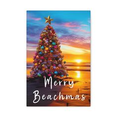 a christmas card with a tree on the beach