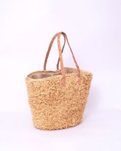 Do you want to look stylish and hippy? Get your hands on this handmade straw bag. It's high quality, eco-friendly, and handcrafted by women in Morocco. Its design is unique and timeless. Get yours now! we are proud to introduce our signature straw french bag to you. it is handmade by our talented artisan who has been working with us for years. this beautiful bag has a unique design that you would find nowhere else. the light and durable material are ideal for taking the bag on your adventures. S Eco-friendly Palm Leaf Bag With Open Weave, Trendy Braided Jute Beach Bag, Eco-friendly Natural Straw Bag, Everyday Braided Rattan Bag, Brown Braided Beach Bag For Summer, Summer Brown Braided Beach Bag, Brown Braided Beach Bag, Trendy Woven Jute Bucket Bag, Bohemian Brown Straw Bag For Spring