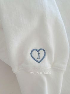 This is for adding on to the sleeve. Outline of a heart with the initial of your choice on the inside. Can be added on to sweatshirt or t shirts. Embroidered White Sweatshirt For Gift, White Embroidered Heart-shaped Top, White Embroidered Tops With Heart Design, White Sweatshirt With Letter Embroidery As Gift, Embroidery Gifts For Him, Sleeve Outline, Angel Embroidery, Embroidery Personalized, Initial Sweatshirt