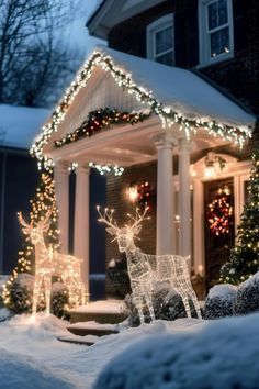 a house covered in christmas lights and decorated with reindeers, trees and snowflakes