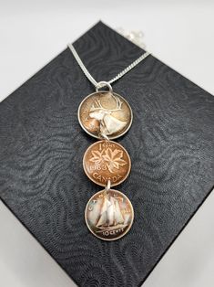 "I make this unique style of triple coin pendant using old Canadian coins. The quarter and dime are all pre 1967 and made from .80 silver.  I use pre 1992 pennies when they were still copper. I am able to customize the coin years for you if you like, if I have the coins. This piece comes on a 20\", sterling silver chain. The pictures are only an example of the piece you are ordering. Each piece will vary slightly. Thanknyou for your interest in Lost Things. Handcrafted on Vancouver Island." Creepy Doll Halloween, Coin Crafts, Lost Things, Canadian Coins, Creepy Doll, Doll Halloween, Creepy Dolls, Old Coins, Coin Jewelry