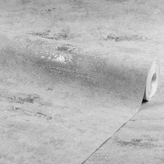 a roll of toilet paper sitting on the ground