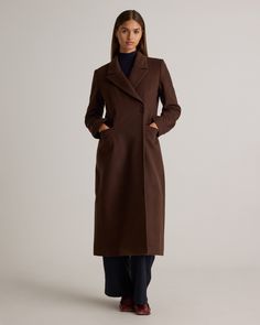 Step into timeless elegance with our Italian Wool Tailored Coat, a masterpiece of refined tailoring and luxurious fabric. Crafted from the finest Italian wool, this coat offers unmatched warmth, texture, and durability while exuding a sleek, polished silhouette that defines sophisticated outerwear. The fitted waist, streamlined seams, and minimalist detailing give it a modern yet classic appeal, perfect for both professional settings and evening outings. Thoughtfully constructed with premium cra Executive Office Attire For Women, Double Breasted Wool Coat Women, Burgundy Wool Coat, Dark Brown Wool Coat, Wool Outfits Woman, 100% Wool Coat, Maxi Wool Coat, Wedding Guest Coat, Quince Clothing