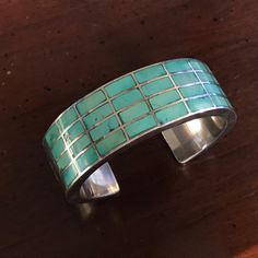 "Vintage Sterling Silver and Sleeping Beauty Turquoise Inlay Row Cuff Bracelet by Renowned Silversmith Artist Federico Jiménez Weighs: 68.2 grams Inner Circumference Measures: 7\" Band Width: 13/16\" Hallmark: JF FEDERICO JIMENEZ was born in Oaxaca, Mexico in 1941 in a Mixtec Indian Community. He came to the USA in 1967 to study and work. He studied jewelry making and design at the University Community School. In 1970 He and his Wife Ellen Belber Jimenez took a trip to the Southwest and fell in Elegant Turquoise Bracelet With Inlay, Elegant Turquoise Inlay Bracelet, Turquoise Bangle Cuff Bracelet For Formal Occasions, Turquoise Bangle Bracelet For Formal Occasions, Formal Turquoise Bangle Bracelet, Turquoise Cuff Bracelet With Polished Finish, Modern Turquoise Cuff Bangle Bracelet, Modern Turquoise Cuff Bangle, Turquoise Stone Jewelry