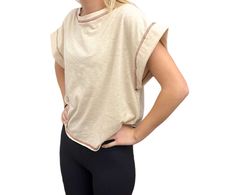 Cross cross back cream top. Crew neck. Short sleeve overlap cropped. Beige Stretch Crew Neck Crop Top, Versatile Beige Stretch Top, Versatile Cream Top For Day Out, Versatile Cream Tops For Day Out, Versatile Cream Tops For Layering, Trendy Stretch Neutral Tops, Casual Cropped Neutral Tops, Versatile Beige Crew Neck Top, Chic Cropped Neutral Tops