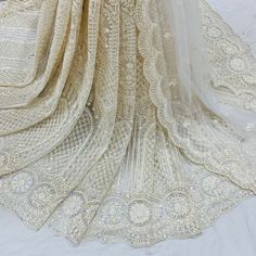 Wedding bridal  lehenga for women ready to wear chikankari lehenga with embroidered blouse and dupatta. * Plus size available at a small up-charge. * Size: This is custom made outfit as per your size. Post your order we will send you a measurements reference sheet using which you can provide details required to make your outfit with best fit. * Fabric and work: Lehenga - Heavy embroidery net fabric. Blouse - Embroidered  fabric. Dupatta - Embroidered net. * Delivery time: This lehenga set will take 2-3 weeks to produce after we have received your sizing details. Don't worry it can be made sooner too, just keep us informed, we will process it accordingly and deliver on or before a delivery date we discuss. *Rush Order : Please use shipping upgrade at checkout to enable expedite shipping opt Elegant Semi-stitched Lace Lehenga, Designer Lace Sharara Semi-stitched, Elegant Embroidered Net Lehenga, Anarkali Style Sharara With Lace Work For Reception, Diwali Embroidered Lace Lehenga, Anarkali Choli With Chikankari Embroidery Semi-stitched, Semi-stitched Anarkali Choli With Chikankari Embroidery, Embroidered Off White Georgette Lehenga, Off White Georgette Lehenga With Intricate Embroidery