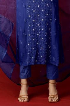 Blue chikankari kurta with mukaish work and straight silhouette. Comes with straight pants and dupatta.
Component: 3
Pattern: Embroidery
Type Of Work: Resham Embroidery and Mukaish
Neckline: Round
Sleeve Type: Sleeveless
Fabric: Georgette
Color: Blue
Other Details: 
Side slits
Shoulder straps
Mukaish work on dupatta
Bead detail on the placket
Occasion: Destination Wedding - Aza Fashions Blue Sleeveless Kurta For Festive Occasions, Blue Sleeveless Traditional Wear For Festive Occasions, Festive Sleeveless Blue Kurta, Festive Blue Sleeveless Kurta, Festive Sleeveless Blue Traditional Wear, Blue Chikankari Embroidery Salwar Kameez, Blue Sleeveless Traditional Wear With Zari Work, Traditional Sleeveless Blue Kurta, Royal Blue Cutdana Dupatta