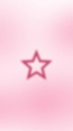 a blurry image of a star on a pink background