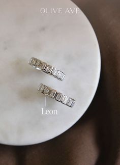 14K White Gold | Leon features emerald cut stones bezel set in half eternity, three-quarter eternity, or full eternity.