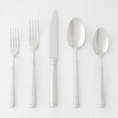 five forks, two spoons and one knife on a white surface