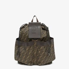 Large backpack in jacquard fabric with brown FF motif. Brown leather details and flap with embossed Fendi Roma logo. Features two front pockets, drawstring closure, inner zip pocket and palladium-finish metalware. It can be worn over the shoulder or held by hand thanks to the additional detachable strap. Made in Italy. One Size Roma Logo, Fendi Logo Design, Fendi Store, Fendi Logo, Stylish Backpacks, Perfume Brands, Large Backpack, Jacquard Fabric, Black Nylons