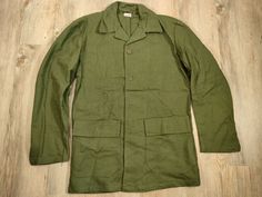 Swedish military jacket. These jackets have two front pockets with flap and button. Closed with buttons. The color may vary slightly depending on the jacket. Dimensions: size: C40 shoulders: 46 cm chest: 53cm length: 75 cm arm length: 59 cm The jacket is new size: C48 shoulders: 48 cm chest: 59cm length: 75 cm arm length: 60 cm The jacket is sewn back and front size: C50 shoulders: 47 cm chest: 61cm length: 76 cm arm length: 61 cm The jacket is sewn back on the right sleeve & there is a stain on Military Style Khaki Utility Jacket With Buttoned Pockets, Military Style Outerwear With Lapel Collar And Pockets, Military Style Outerwear With Flap Pockets And Lapel Collar, Military Style Cotton Utility Jacket With Buttoned Pockets, Military Style Button-up Outerwear With Patch Pockets, Military Utility Jacket With Lapel Collar For Fall, Military Outerwear With Flap Pockets And Lapel Collar, Military Style Outerwear With Buttoned Pockets For Work, Double-breasted Khaki Pea Coat With Pockets