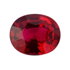 an oval shaped red ruby stone on a white background