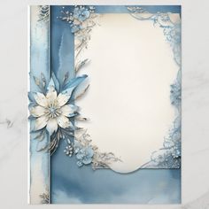 a blue and white card with flowers on the front, along with an empty sheet of paper in the middle