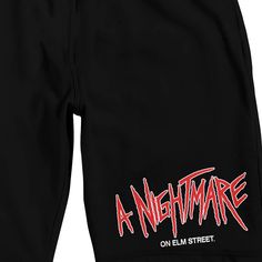 Celebrate your favorite horror movies in comfort with these Nightmare on Elm Street sleep pajama shorts. The shorts feature jagged red text that spell out, "A Nightmare," while white letters below finish the movie's title. The shorts come in black with an elastic waistband. Fans of the Nightmare on Elm Street movie will love these comfy sleep pajama shorts. Red Letters, A Nightmare On Elm Street, Elm Street, Nightmare On Elm Street, Sleep Shorts, A Nightmare, Mens Short Sleeve Shirt, Sleep Set, Text Logo