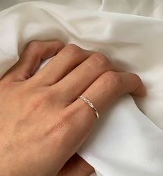 Minimal and dainty, perfect to wear alone or stack with other delicate rings. The blend of Baguette and tapered Baguette crystals make this a beautiful combo. .925 Silver Cubic Zirconia Baguette and Tapered Baguette Hypoallergenic, lead and nickel free Crystal Width 2mm x Length 11mm Band Width 1.5mm #R099-S Jewerly Set, Aesthetic Rings, Stackable Rings Silver, Minimal Ring, Baguette Ring, Handcrafted Rings, Handmade Rings, Moissanite Wedding Bands, Delicate Rings