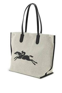 Shopping bag by Longchamp crafted in dotted cotton canvas, characterized by the contrasting iconic horse on one side and lettering logo print on the other side. Leather trims, base and double handle that can be worn by hand or on the shoulder, side buttons and central snap closure in silver-tone metal, unlined interior with a zip pocket and two flat pockets. Longchamp Roseau, Duffel Bag Backpack, Lettering Logo, Crossbody Tote, Large Tote Bag, Women Accessories Bags, Leather Gloves, Small Leather Goods, Womens Tote