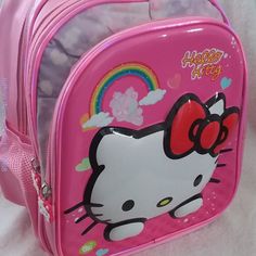 Hello Kitty Embossed Front Pink Backpack Character Hello Kitty Back To School Collectibles Large 7 Inch Depth Spacing For Middle School Study Length 15.25 In Width 11 In Depth 7.5 In Satin-Like Finish On Sturdy Washable Fabric Shoulder Straps 3 Zipper Sectioned Compartments 4 Hello Kitty 2 Side Pocket For Beverages Pink Backpack With Cat Design For Daily Use, Pink Cat Design Backpack For Daily Use, Hello Kitty Pink Shoulder Bag For Travel, Pink Hello Kitty Shoulder Bag For Travel, Hello Kitty Print School Backpack, Pink Hello Kitty Travel Bag, Travel Shoulder Bag In Pink With Hello Kitty Print, Cute Pink Bag With Zipper Closure, Pink Hello Kitty School Backpack