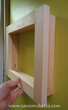 someone is making a shelf out of wood