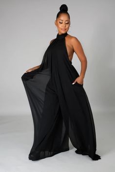 Halter neck, wide leg jumpsuit featuring a button closure around the neck with an open back. Pair this cutie with a belt or rock it all alone! Check out our other colors. Model is wearing a small. Material Wide Leg Jumpsuit For Beach, Casual Wide Leg Jumpsuits And Rompers For Party, Casual Wide-leg Jumpsuits And Rompers For Party, Chic Flowy Jumpsuits And Rompers For Party, Chic Wide Leg Jumpsuits And Rompers For Beach, Chic Wide-leg Jumpsuits And Rompers For The Beach, Chic Wide Leg Beach Jumpsuits And Rompers, Chic Wide-leg Beach Jumpsuits And Rompers, Chic Flowy Jumpsuits For Party