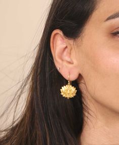 Embrace the grace and beauty of the lotus flower with these dangling Lotus earrings. Radiating the very essence of elegance and charm, each earring is a delicate masterpiece designed to uplift your spirit. Dangling lotus earrings in full bloom Made of gold-plated brass Earrings are 3/4 inches across Modern Gold Earrings, Latest Earrings Design, The Lotus Flower, Blooming Lotus, New Gold Jewellery Designs, Lotus Earrings, The Lotus, Fancy Jewellery, In Full Bloom